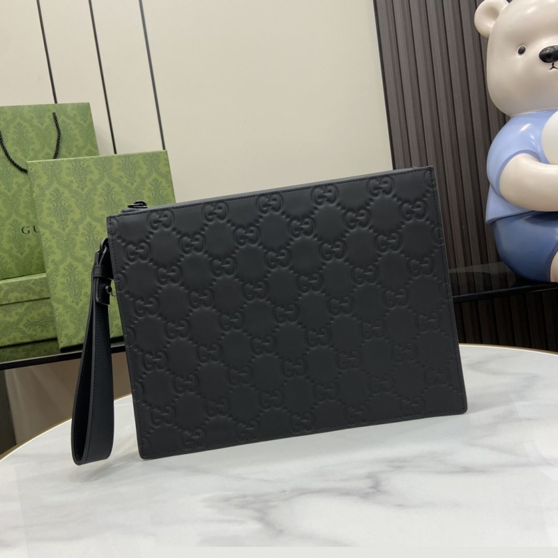 G*u*i clutch bags